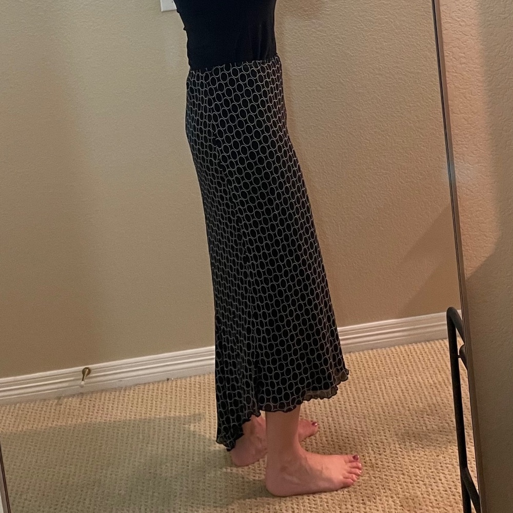Black print viscose skirt with variable hem. elastic waist size M/L